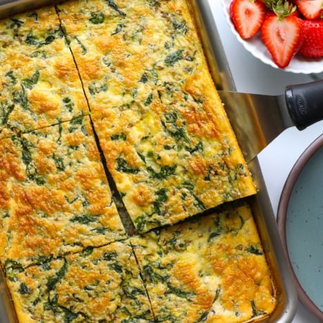 cottage cheese egg bake sliced into big squares in a baking dish.