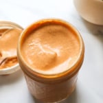 healthy chipotle sauce in a glass jar with a lid.