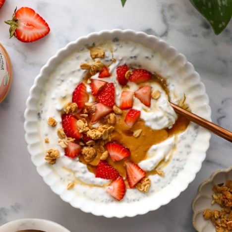 greek yogurt bowl with chia seeds, strawberries, and peanut butter.