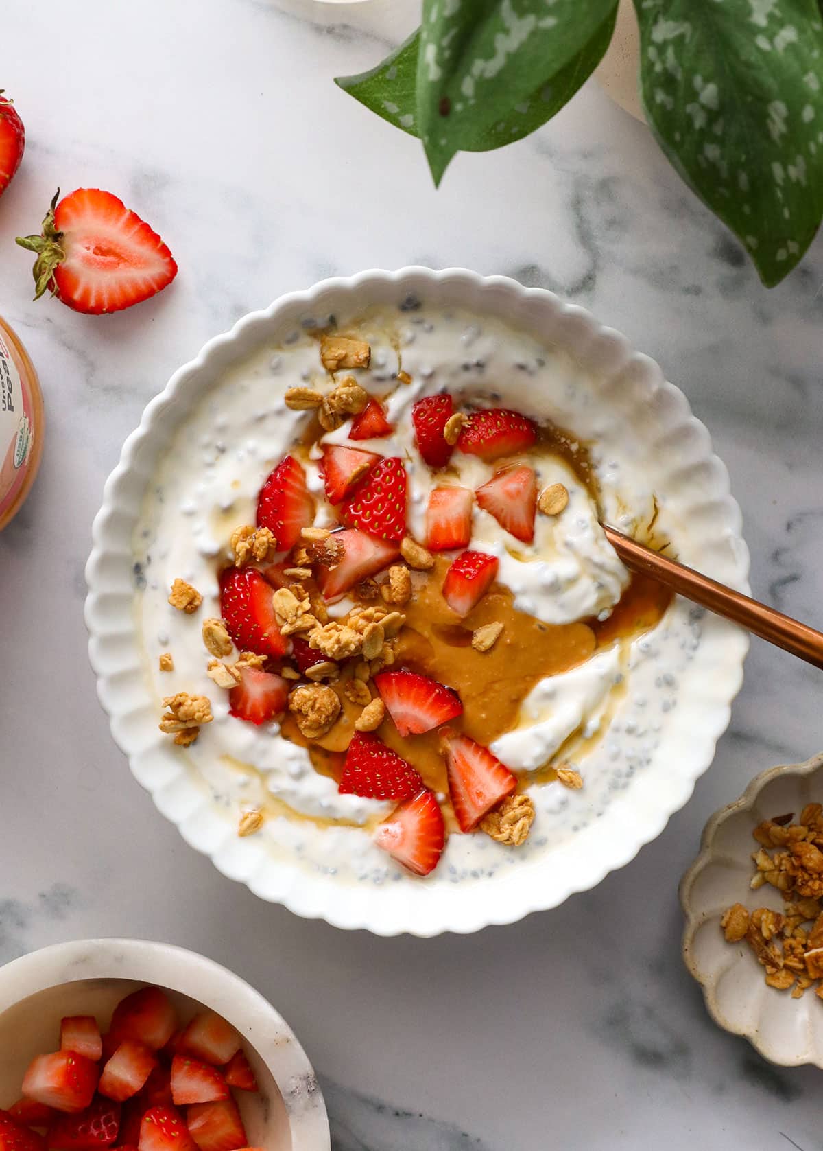 greek yogurt bowl with chia seeds, strawberries, and peanut butter.